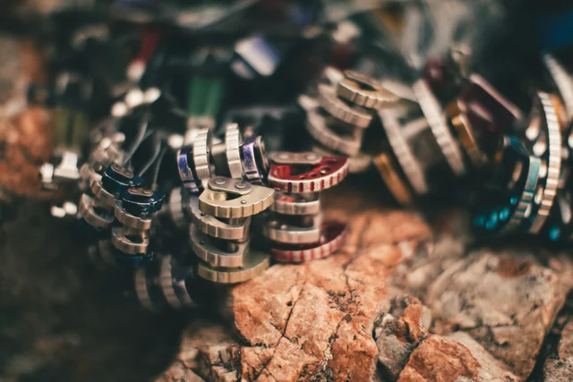Stacked rings and tokens on a wooden surface