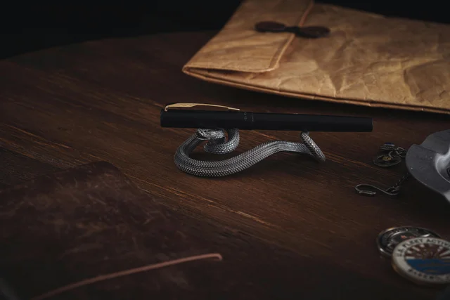 Elegant desk setup with a pen and vintage accessories