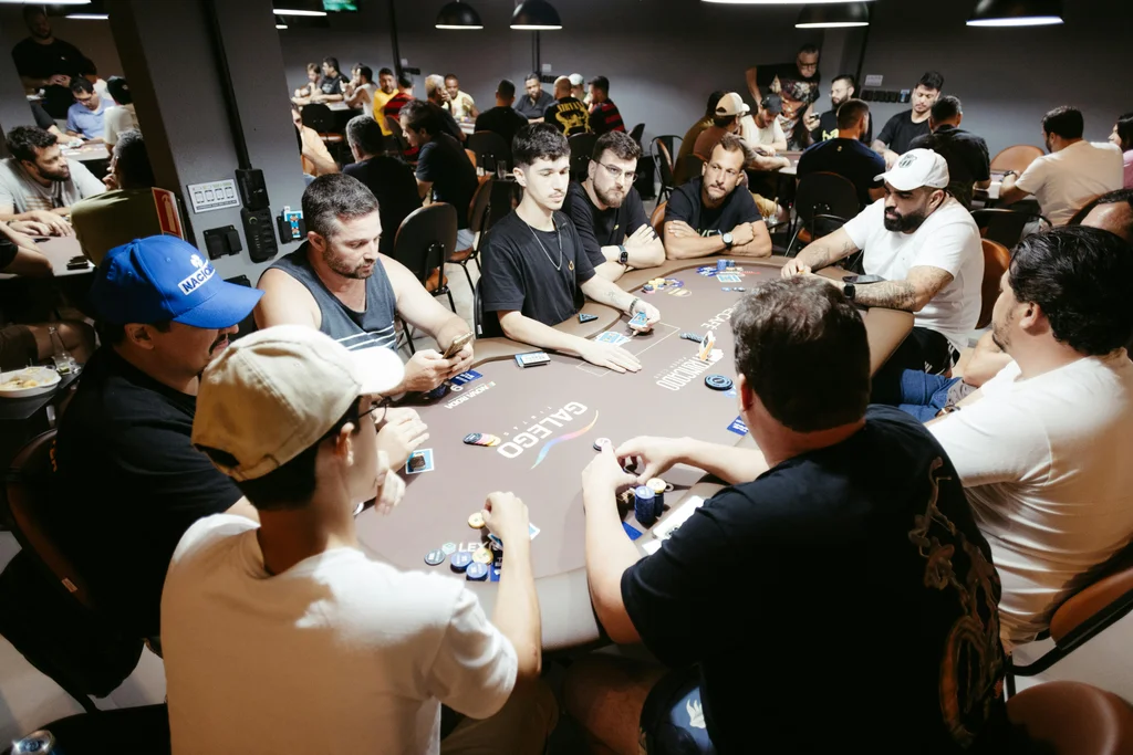 Adults engaged in a lively poker game at a casino