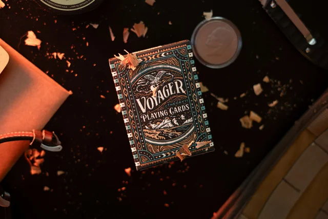 A strategy book on a table next to other items