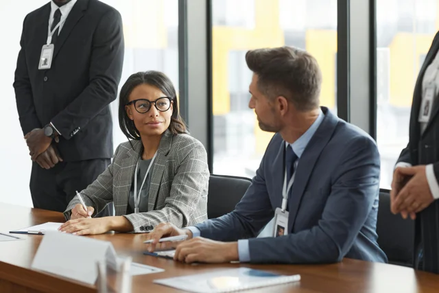 Diverse business professionals discussing strategy in a boardroom