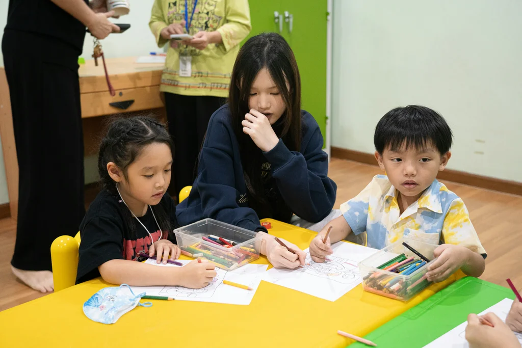 Teacher guiding students in a learning session