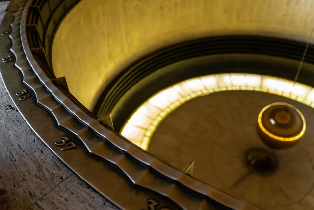 A close-up of a roulette wheel with golden numbers